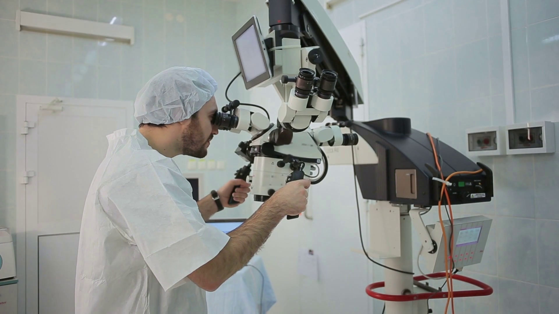 Doctor Loking At Monitor At Big Microscope Stock Footage SBV303936830