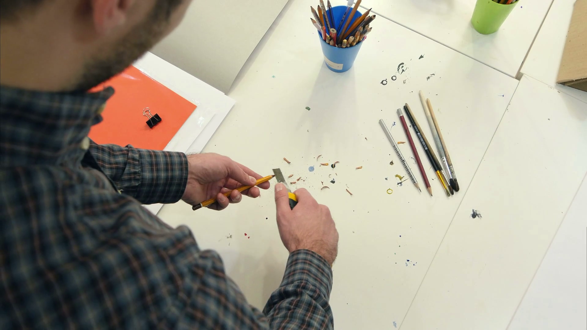 Man sharpening pencil with a pencil sharpener Stock Video Footage