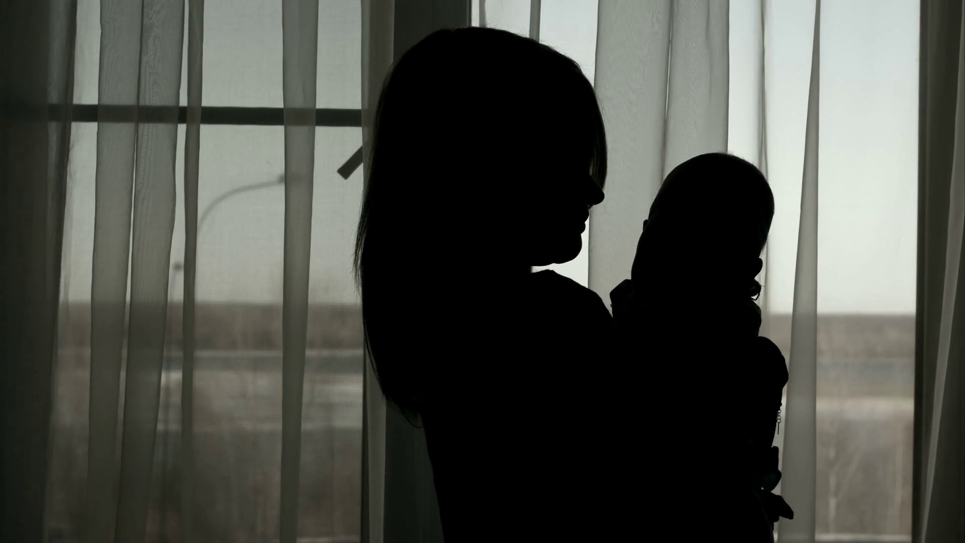 Silhouette Of Mother Throwing Baby Up Stock Footage SBV304387663