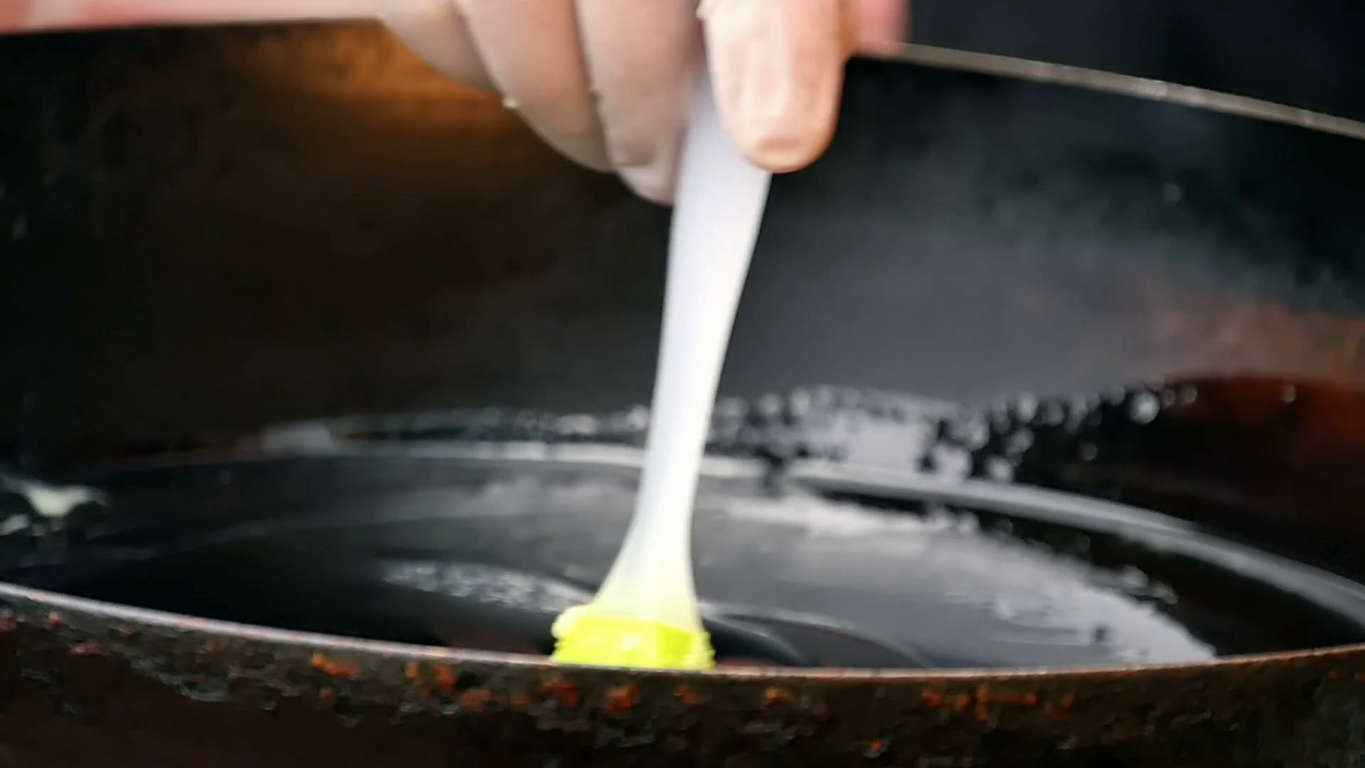 Oiling Frying Pan Using Silicone Brush Stock Footage SBV314366417