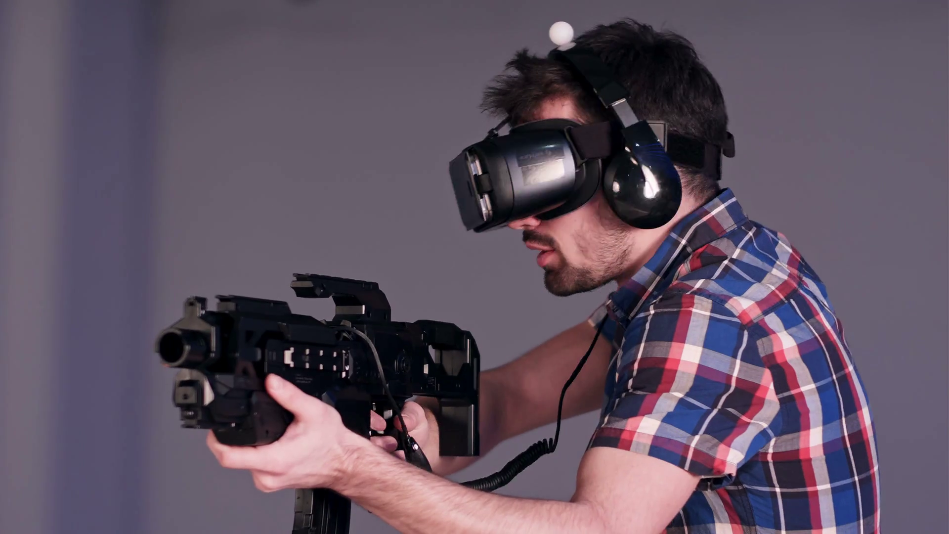 Young friends playing VR sniper game with virtual reality guns and