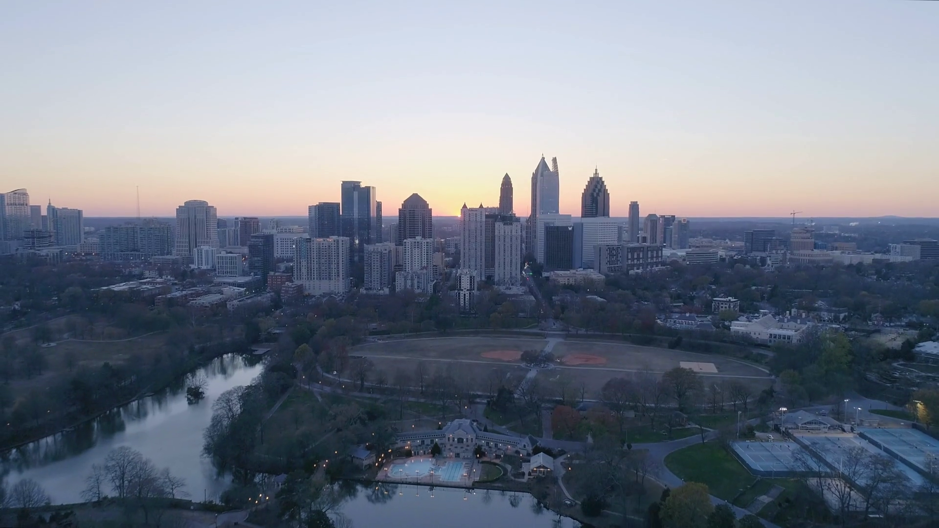 Aerial of the Atlanta Skyline and Piedmont Park at Sunset Stock Video