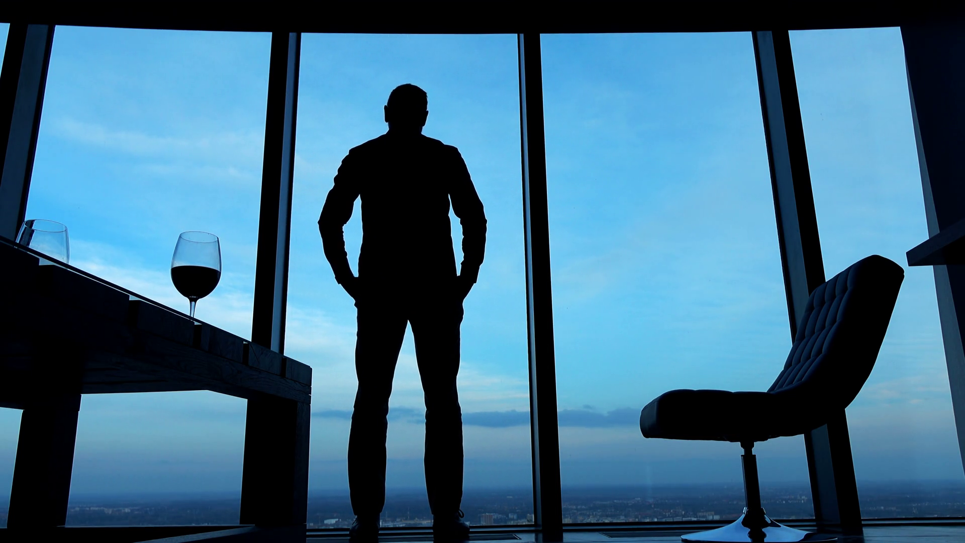 Silhouette of young man walking and admire city view from the window ... Silhouette Man Walking Tunnel