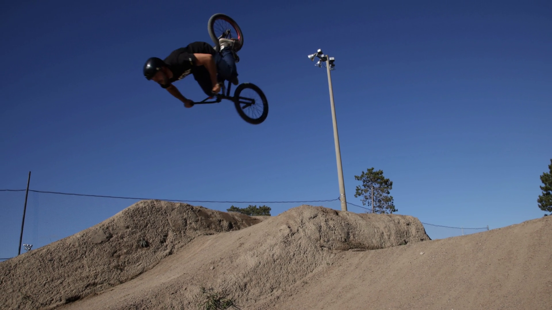 Bmx Back Flip Trick On Dirt Jump Blue Sky Stock Footage SBV347497832