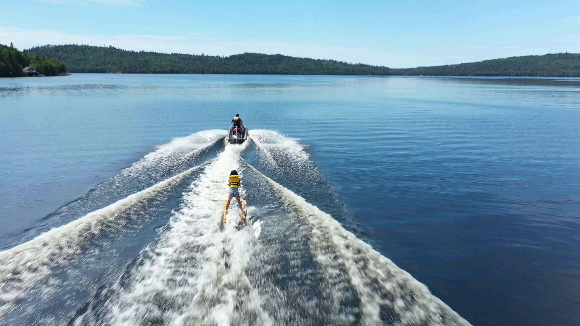 Litle Girl Water Skiing Behind A Jet Ski Stock Video Footage 0007 SBV