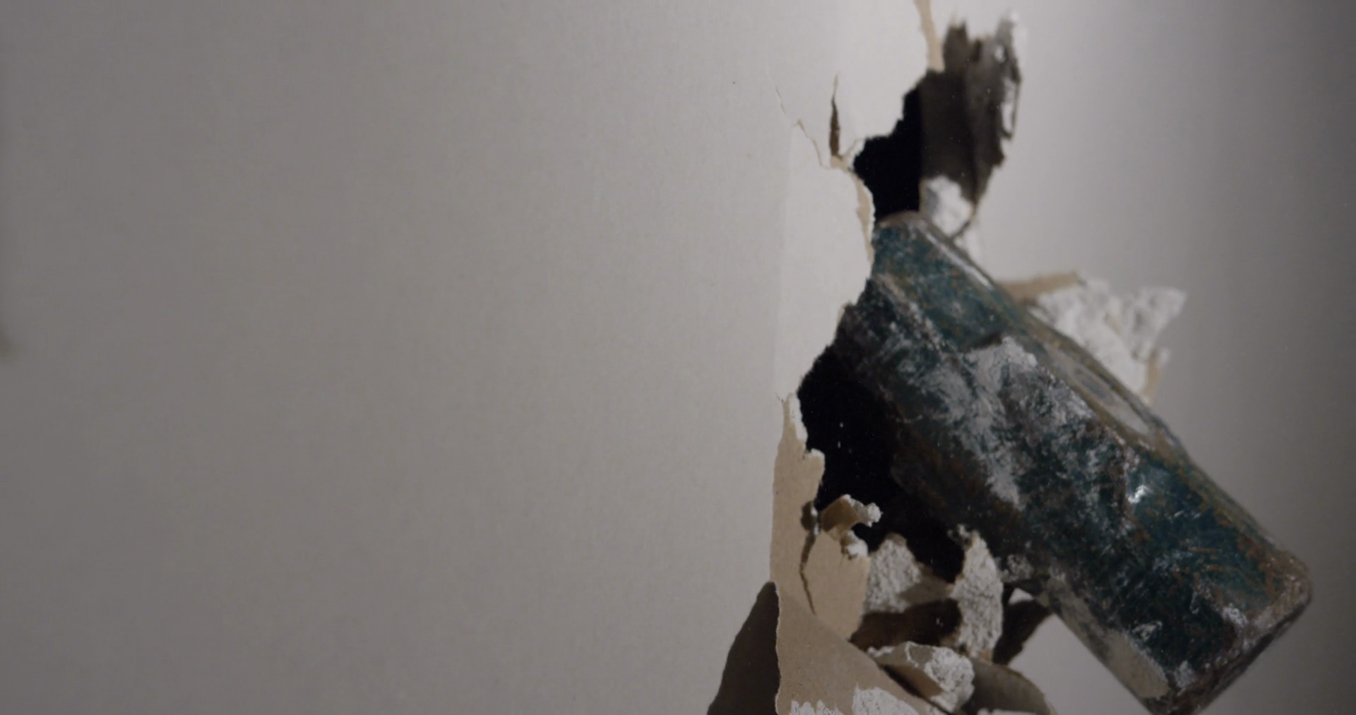 Man Punching Through Drywall In Slow Motion Stock Footage SBV347710821