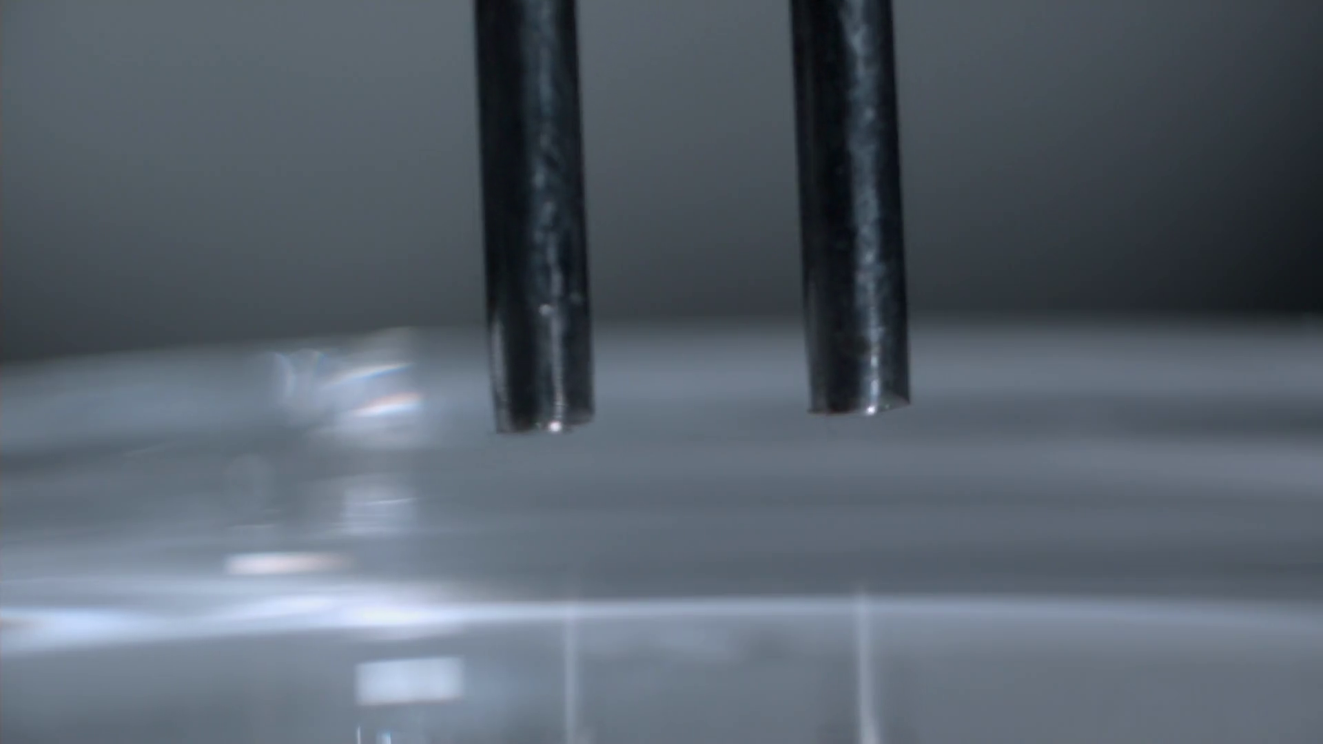Slow Motion Tuning Forks In Water Demonstrating Resonance Stock Video