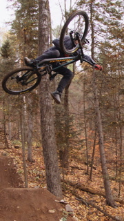 Vertical One Footed Mountain Bike Tabletop Trick