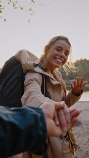 Woman leading husband by hand to quarry during hiking