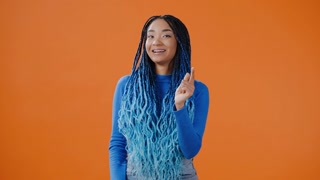 Optimistic lady claps hands and makes thumb up gesture