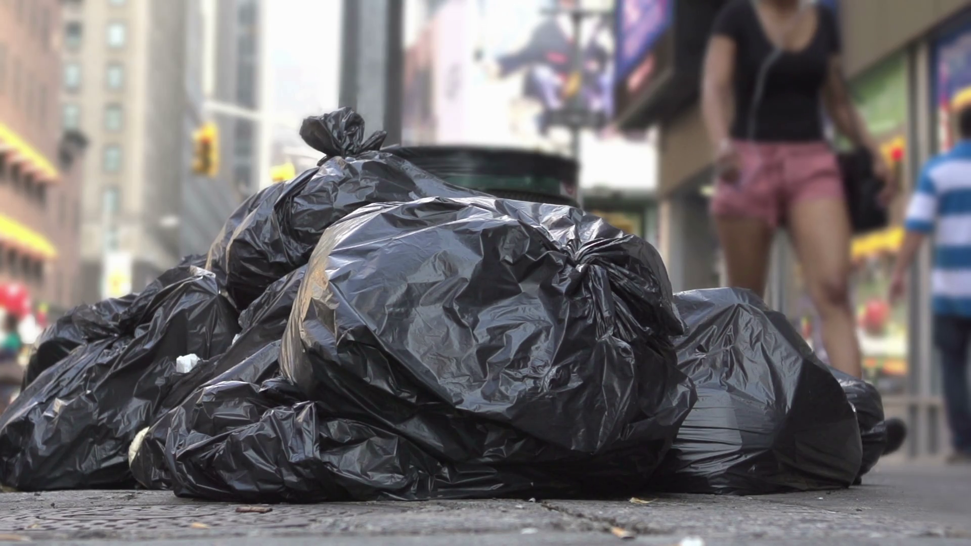 Bags of trash in city streets slow motion Stock Video Footage 0020 SBV