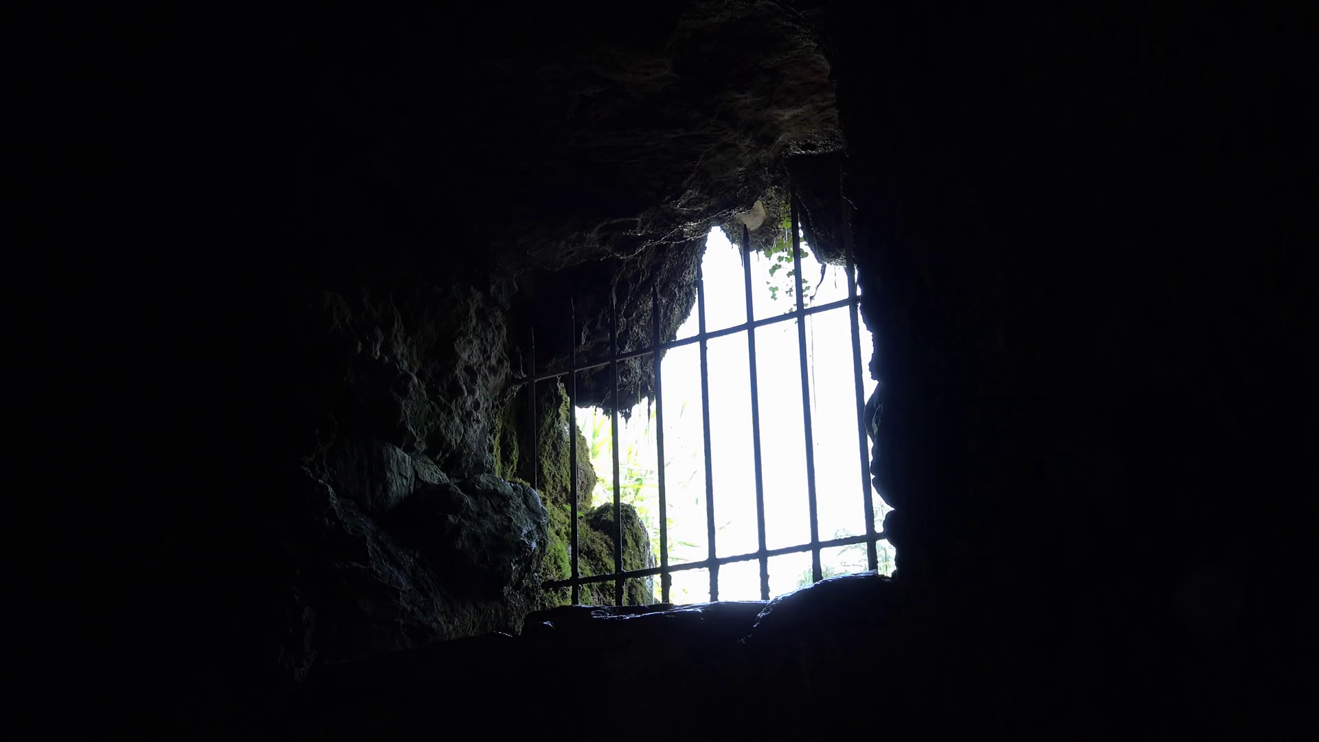 Barred up hole in cave creating prison 4k Stock Video Footage 0018 SBV