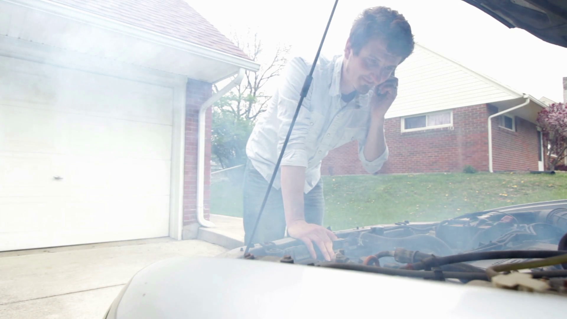 Car smoking from under hood Stock Video Footage 0009 SBV301159069