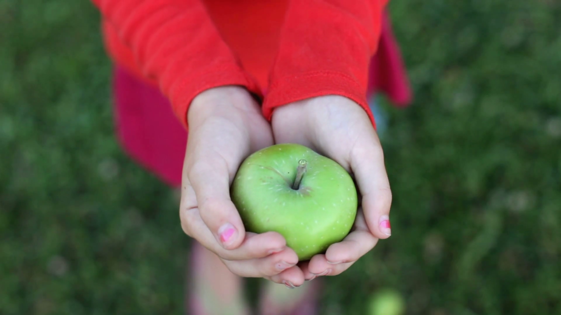 Child Opening Closing Hand With Apple Stock Footage SBV301093330