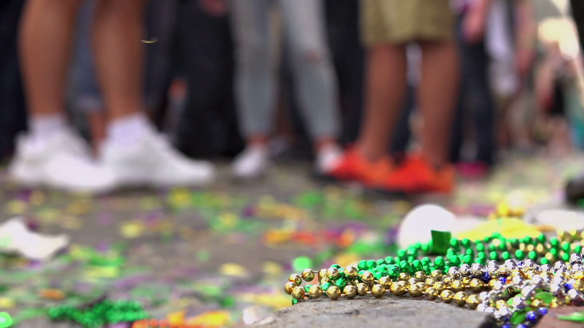 Focus Beads on floor of Bourbon street during Mardi Gras Stock Video
