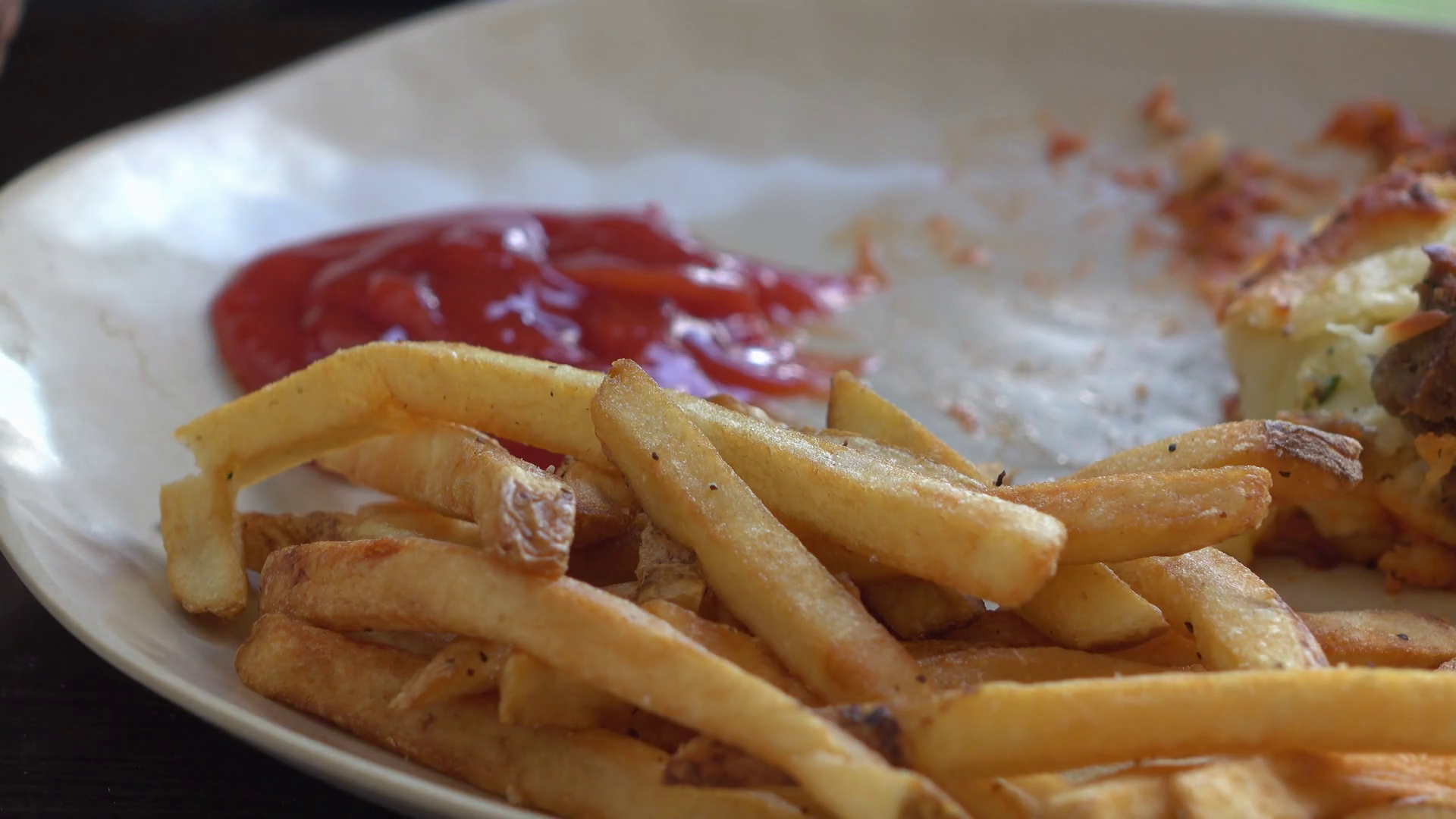 French fries and ketchup on dinner plate 4k Stock Video Footage 0010