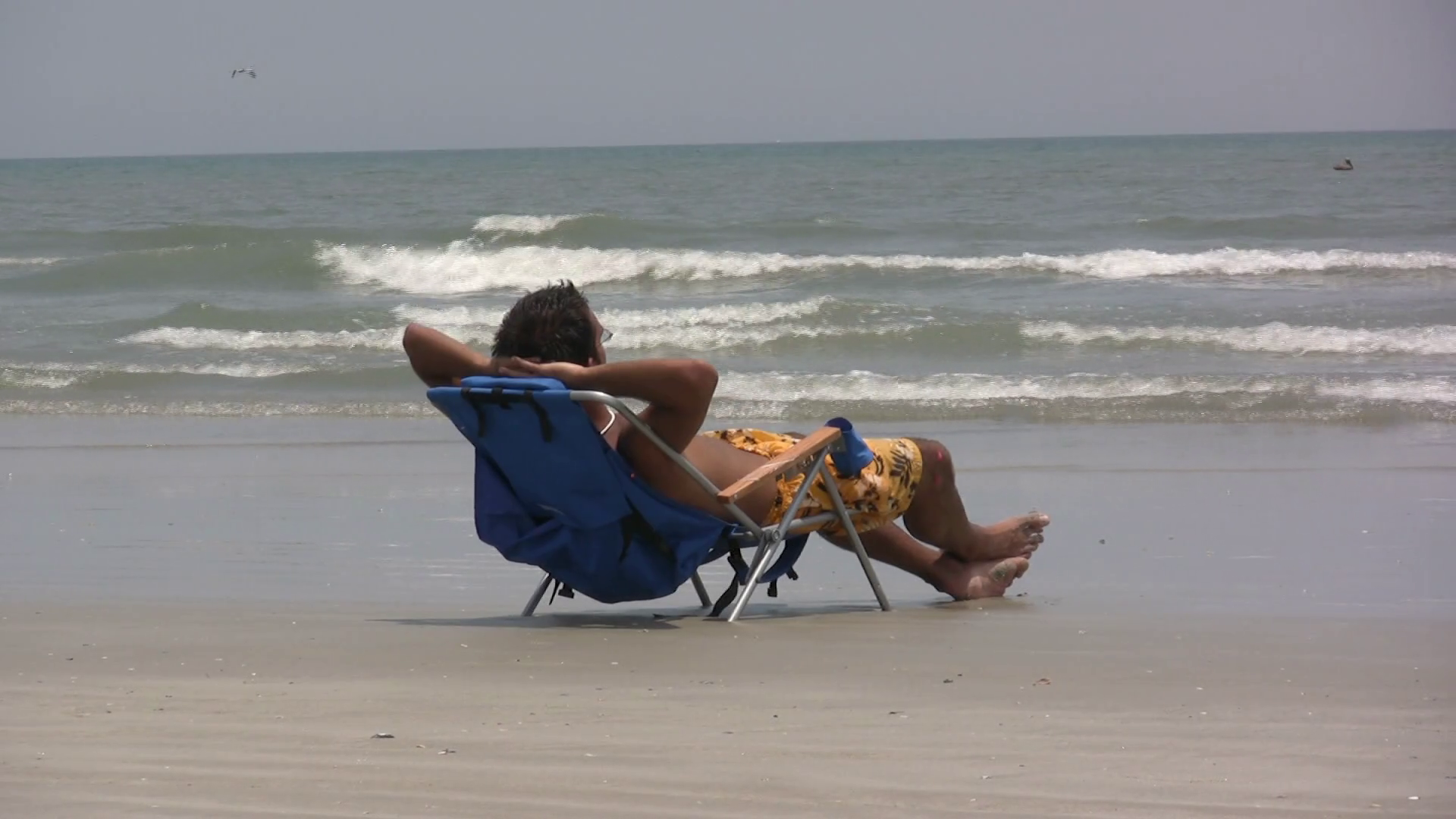 Guy on Beach soaking up some sun rays. Stock Video Footage 0013 SBV300817455 Storyblocks