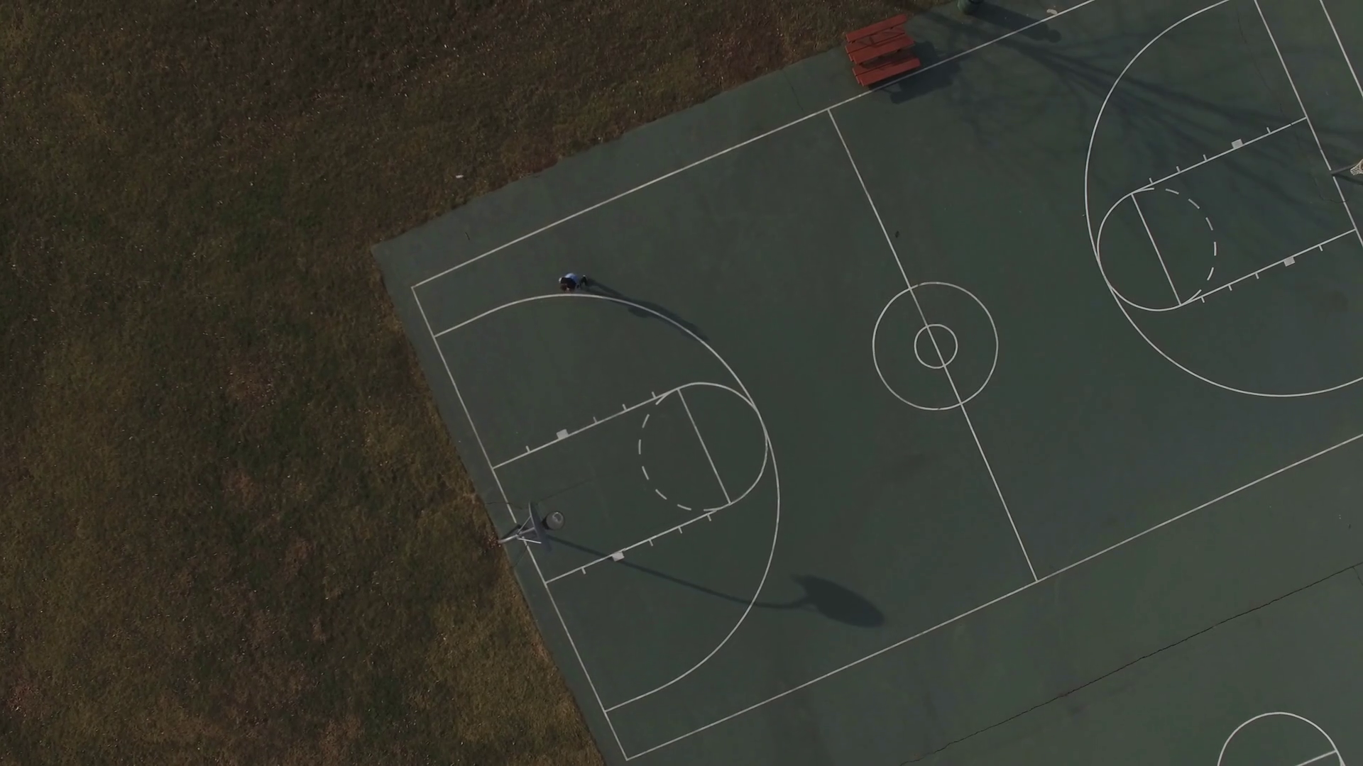 Player On Basketball Court Extreme Aerial Stock Footage SBV305197143