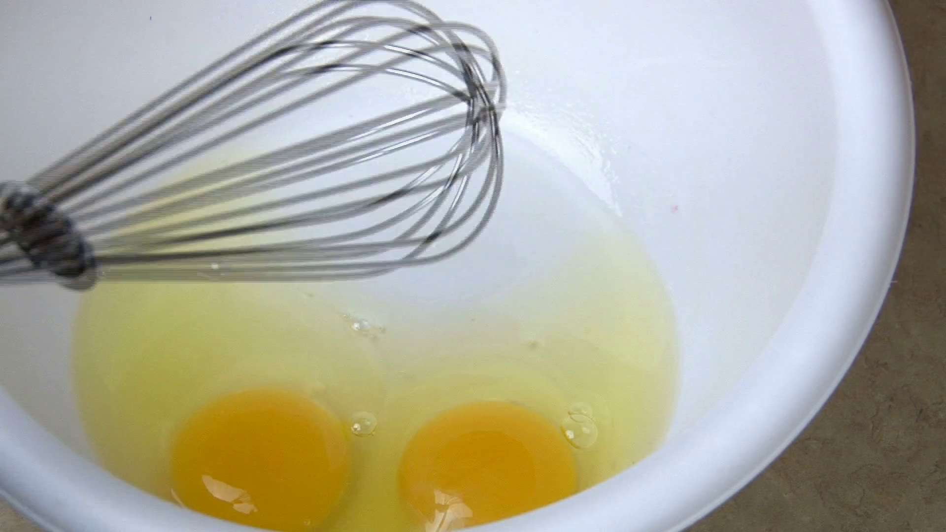 Scrambling Eggs with Whisk Stock Video Footage 0013 SBV300817760