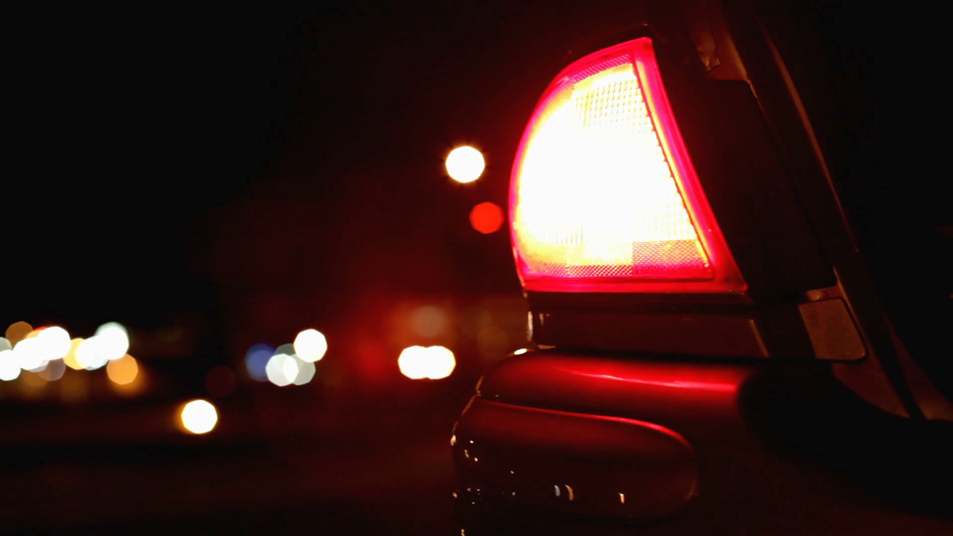 Tail light flashing on side of road Stock Video Footage 0013 SBV