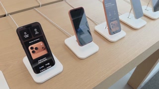 Browsing new iPhone 17 display at store 4k