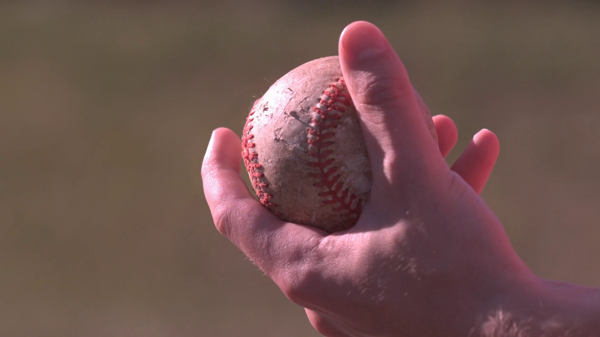 Hand gripping baseball in slow motion Stock Video Footage 0017 SBV
