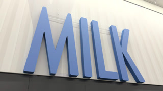 Large MILK wall sign at grocery store 4k