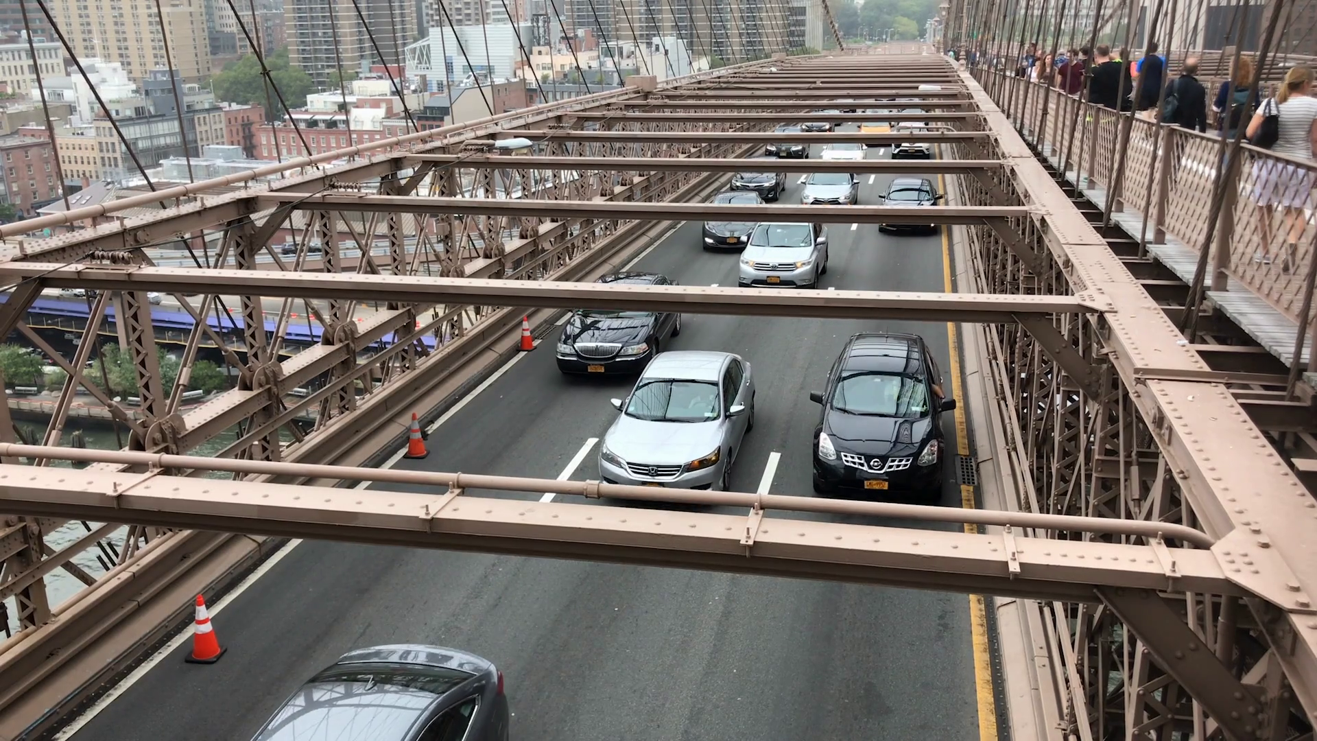Look On Down From The Bridge Top down view of cars crossing Brooklyn Bridge NYC Stock Video Footage