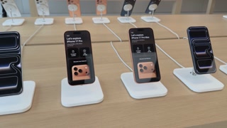 Various models of iPhone 17 on display at store 4k