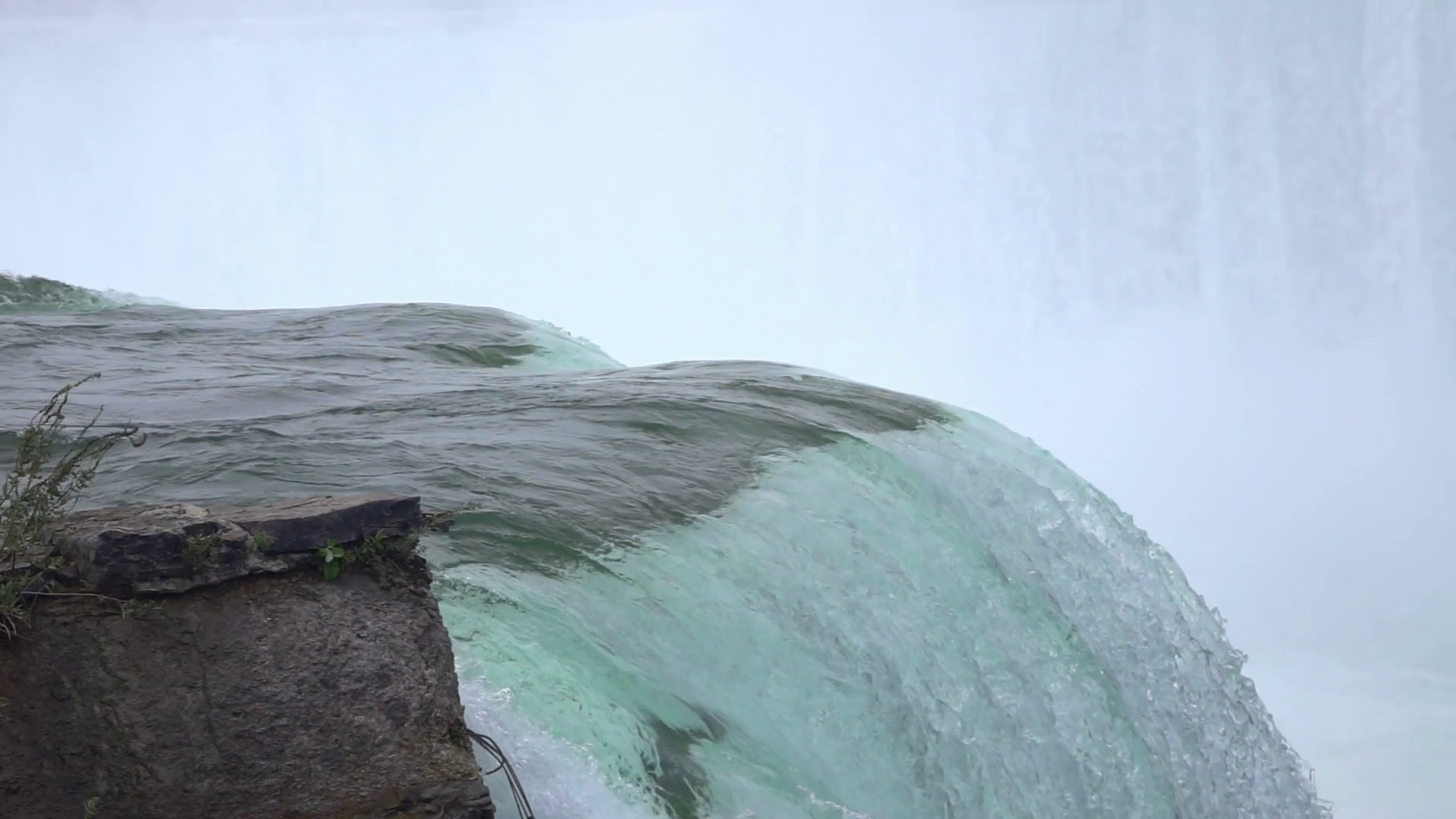 Waterfall edge with flowing water slow motion Stock Video Footage 0013