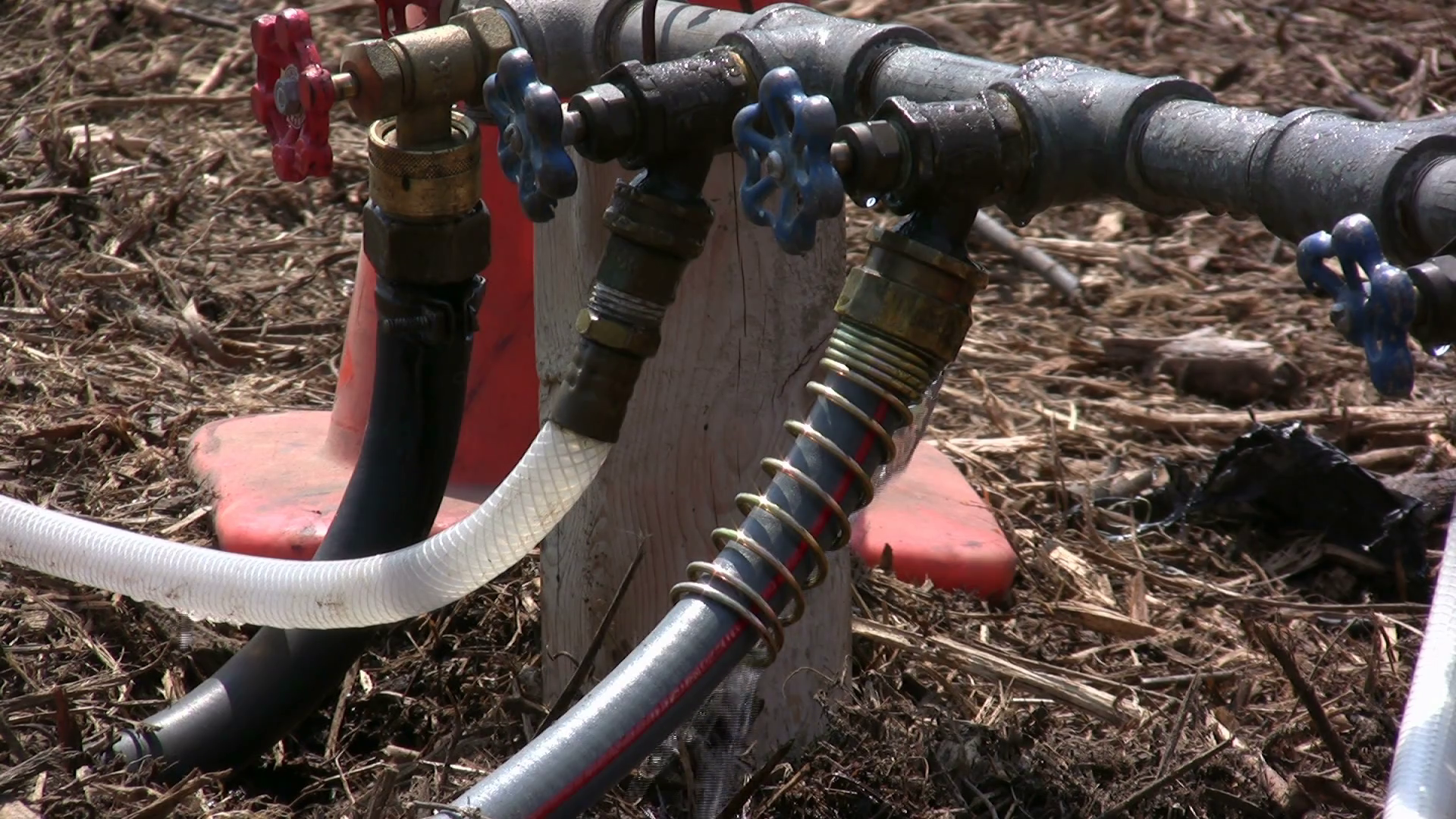 Water dripping from three hoses Stock Video Footage 0013 SBV301058614