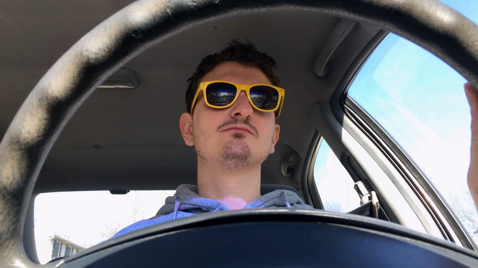 Young man with sunglasses driving car on sunny day 4k Stock Video
