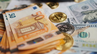 Background with US Dollar and Euro bills, BTC bitcoins and bills to pay.