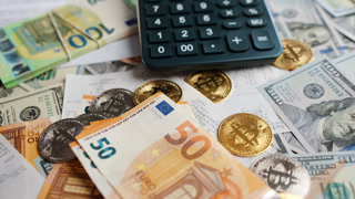Background with US Dollar and Euro bills, BTC bitcoins and bills to pay.