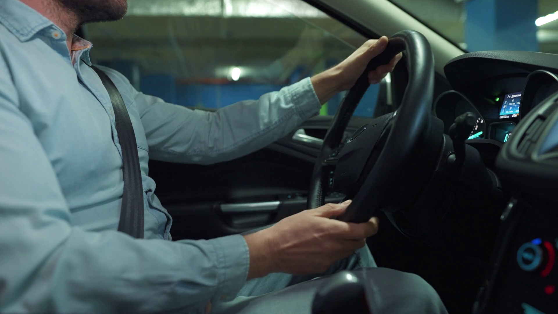 Man driving in innovative automated car using selfparking autopilot