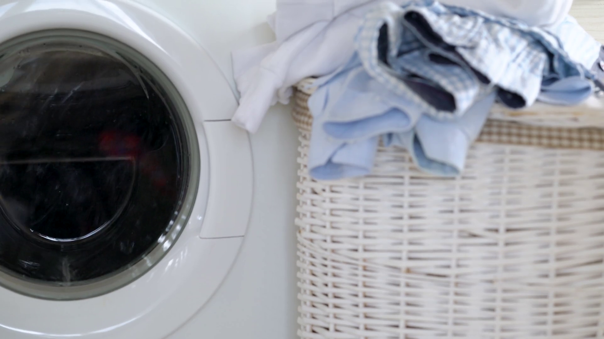 Laundry is washed in the washing machine, and clean things are on the