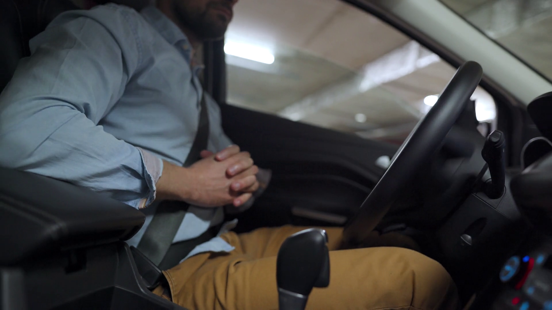 Man driving in innovative automated car using selfparking autopilot