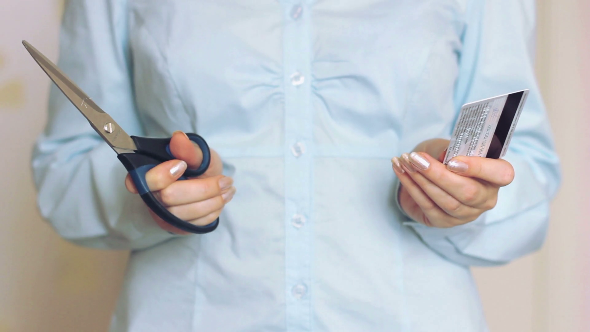 Woman cut a credit card in half Stock Video Footage 0010 SBV305895793