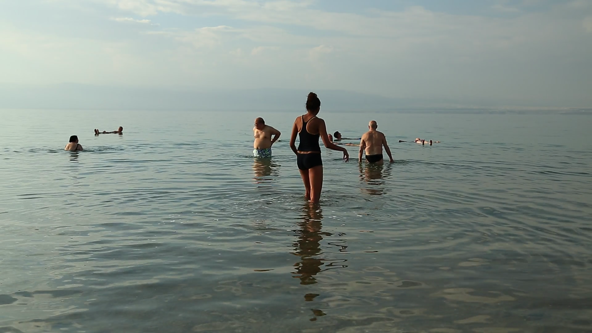JORDAN, DEAD SEA, DECEMBER 8, 2016 People relax in very salty water of