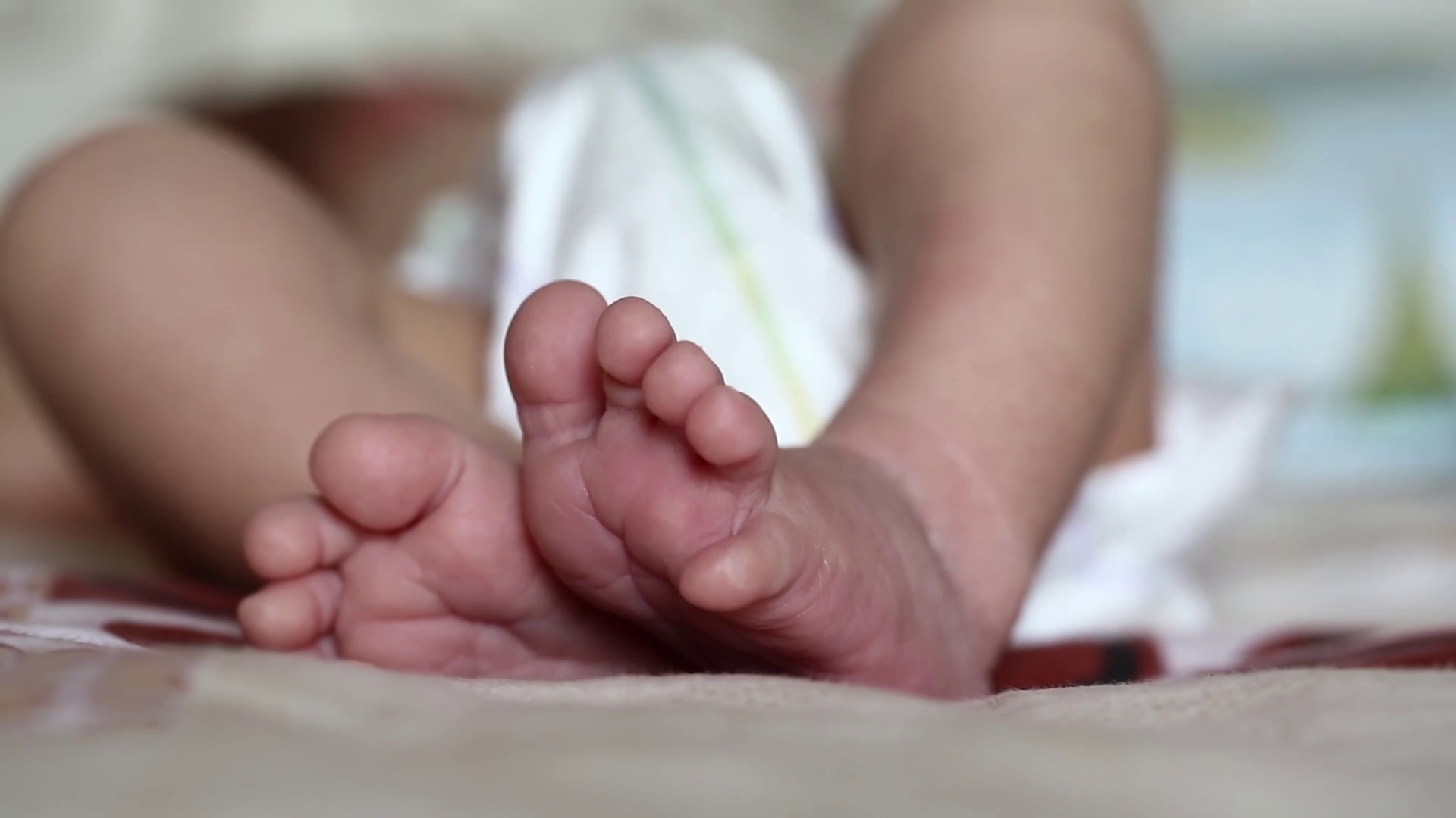 Newborn baby feet. Little feet of neonatal three weeks old baby boy