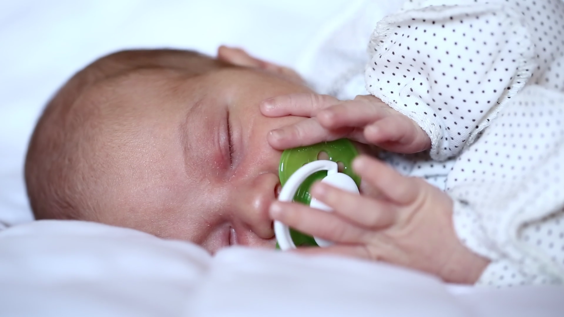 Newborn baby sleeps with pacifier in mouth Stock Video Footage 0020