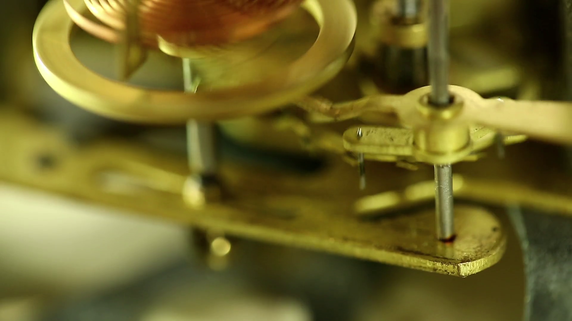 Working internal alarm clock mechanism. Clock mechanism macro shot with