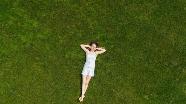Woman Laying On Grass Stock Footage: Royalty-Free Video Clips - Storyblocks