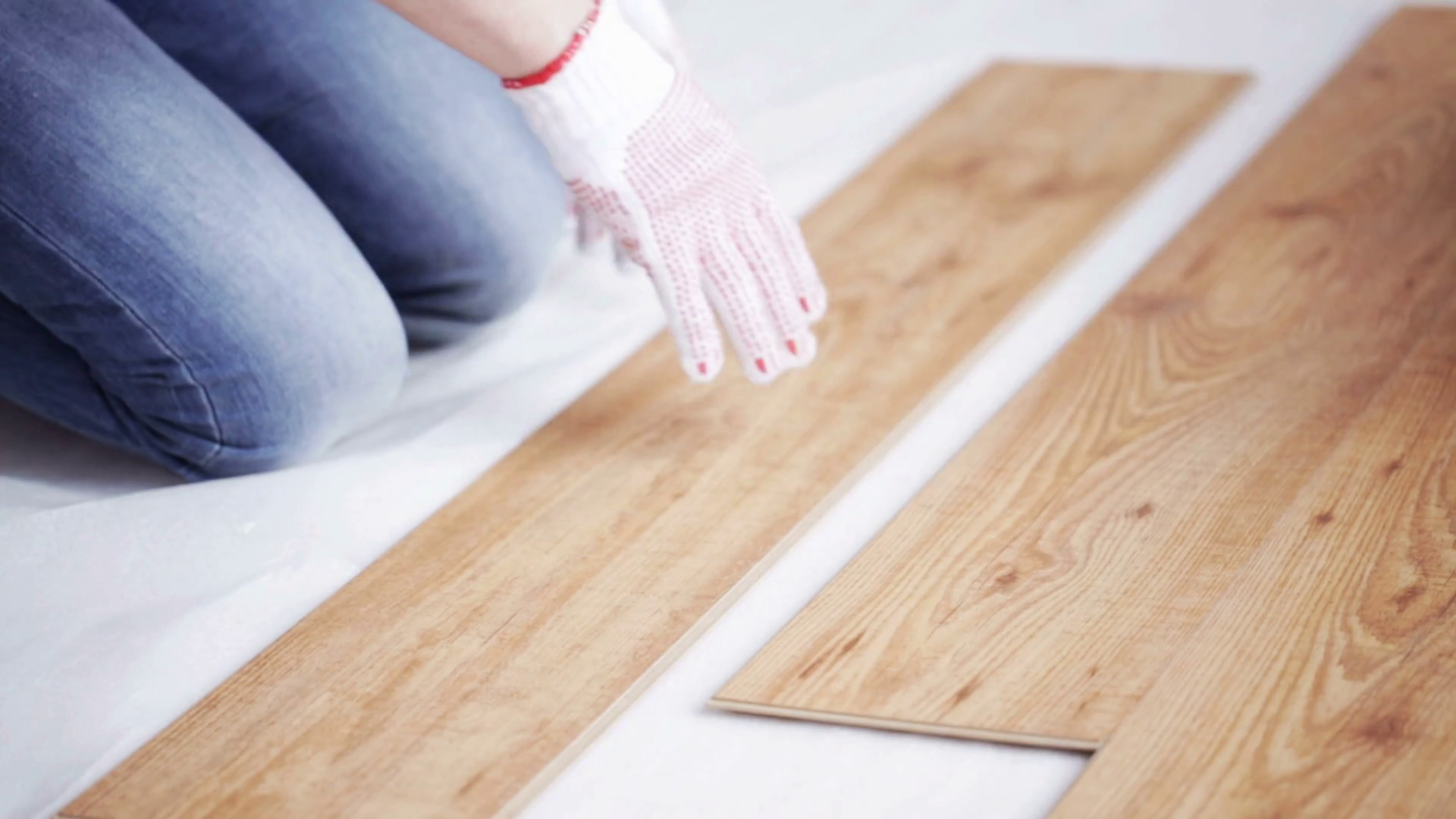 repair, building, floor and people concept close up of man installing