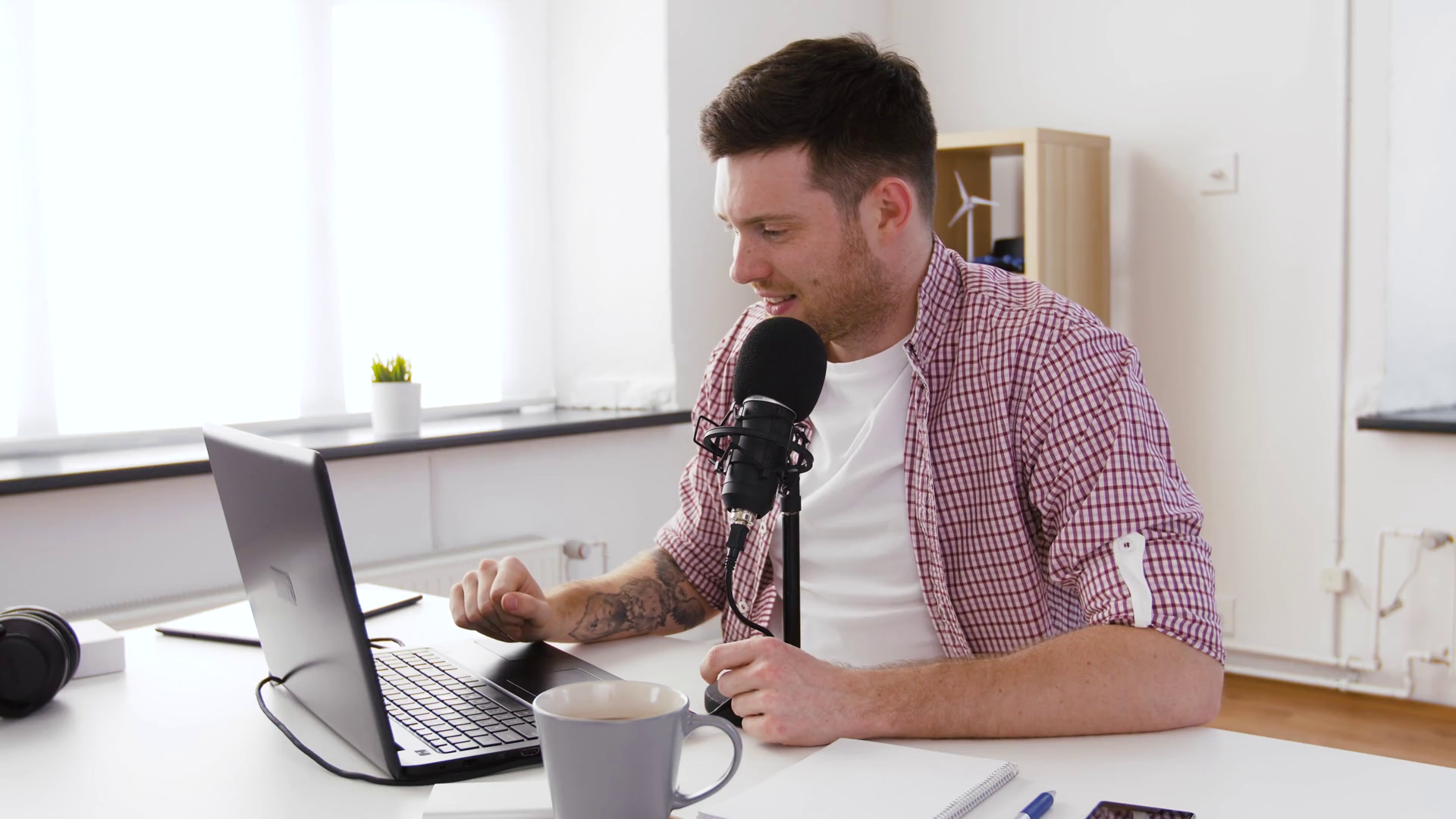 technology, mass media and audioblog concept happy young man with