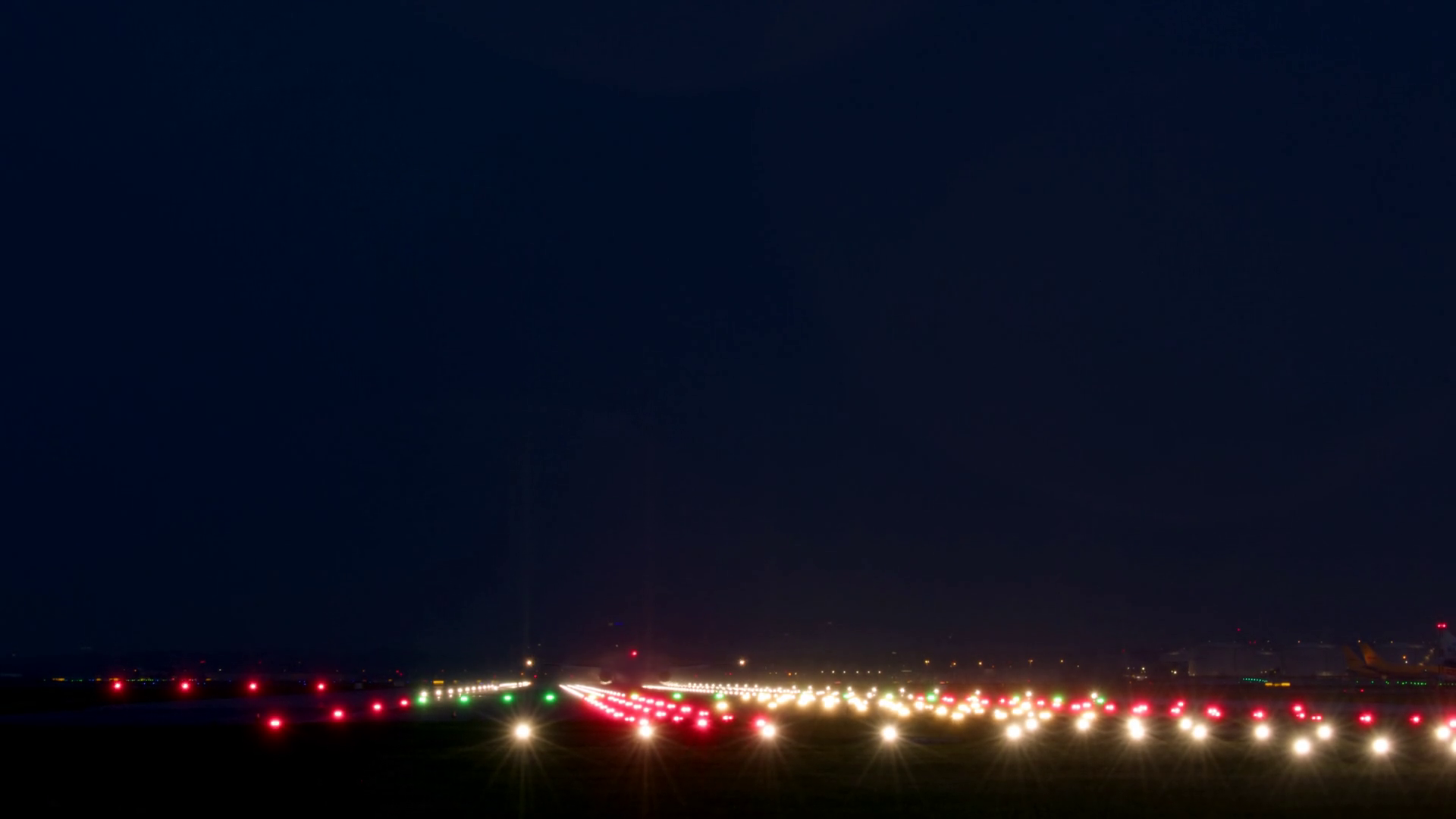 A Airplane Is Landing On Runway At Night Stock Footage SBV349249371