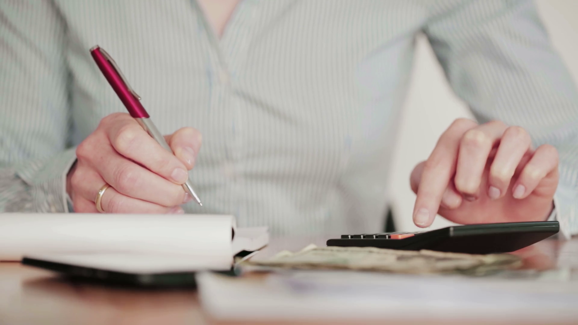 An Accountant Uses Calculator Writes Down Stock Footage SBV302773264