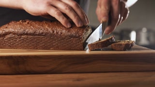 Closeup shot of a man making banana bread at home. Home cooking and baking concept.