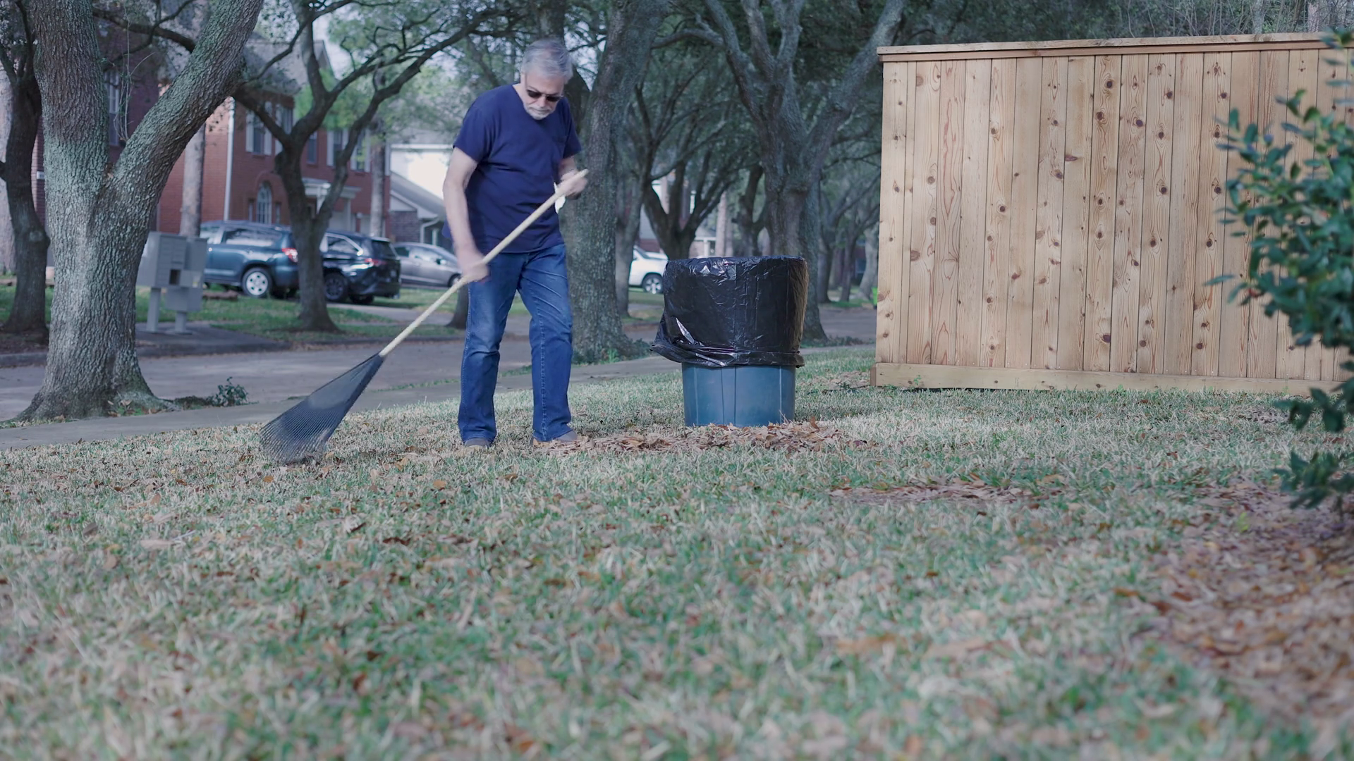 Senior Man Raking Leaves In Yard Stock Footage SBV-351908550 - Storyblocks