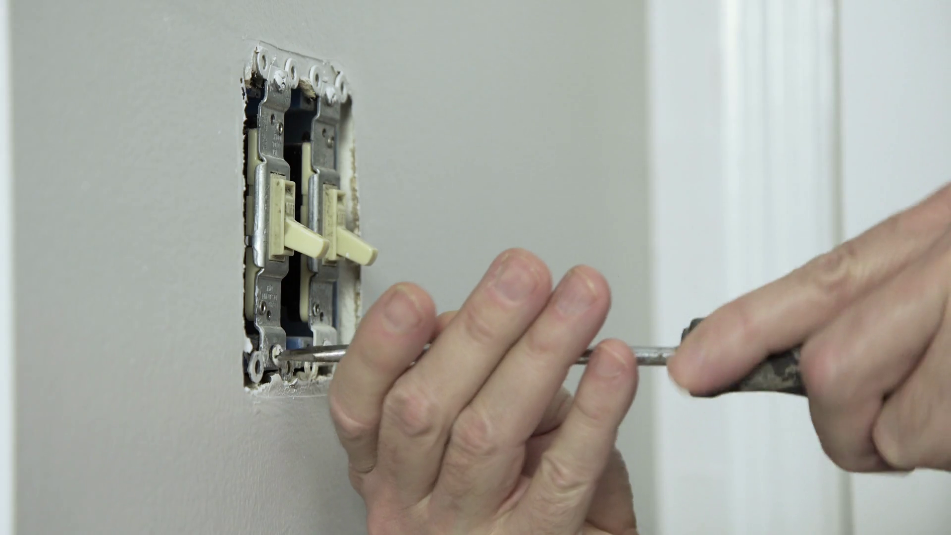 Electrician Removing Old Toggle Wall Switch Stock Footage SBV313479807